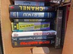 Box of books including The Hardy Boys, John Grisham, Technical writing and more