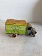 John Deere plate, die-cast model car, and International model tractor