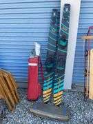 Golf bag with misc. clubs, skis and horseshoe game