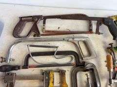 Tote of hand saws and clamps