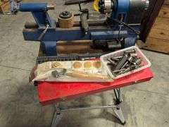 Fisch wood lathe machine, Black and Decker workmate, lathe bits, and woodworking tools