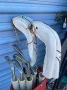 Golf bag with misc. clubs, skis and horseshoe game