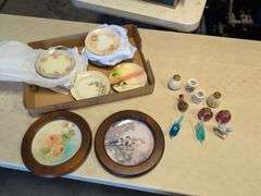 Assortment of decorative plates and glass decor