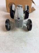 Ford 8N die-cast model tractor with Dearborn plow and other Ford tractor - 1/16 scale, dirty