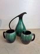 Vases with silk flowers, cups, and more