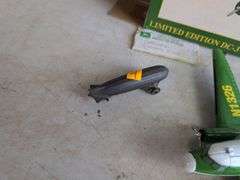 John Deere airplane bank and (2) other metal plane toys