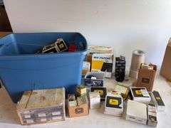Tote of filters, parts, and more - John Deere, Wix, etc