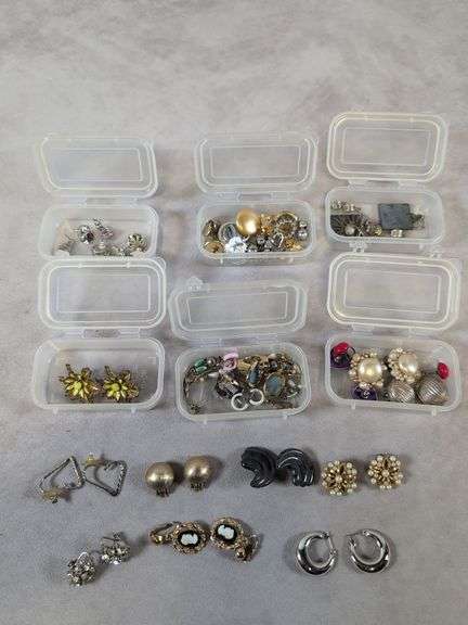 Assortment of costume jewelry - mostly earrings and decorative pins