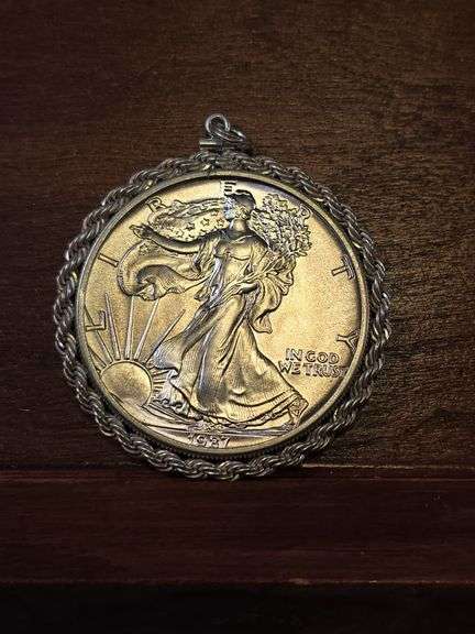 1987 SILVER EAGLE IN STERLING SILVER BEZEL